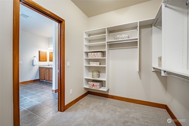 walk in closet featuring tile patterned floors