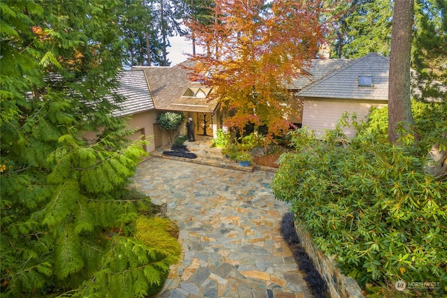 view of property hidden behind natural elements