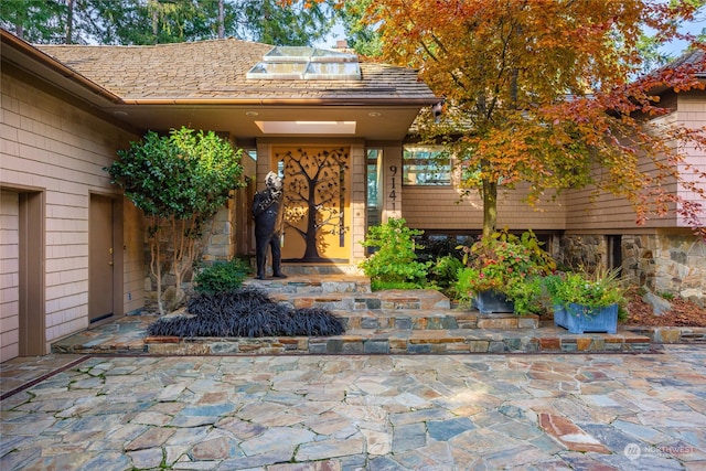 doorway to property with a patio