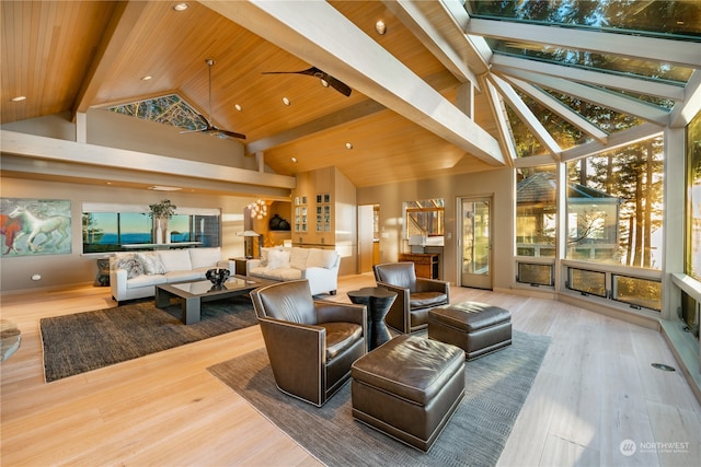 interior space featuring hardwood / wood-style flooring, beam ceiling, and ceiling fan