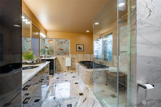 bathroom with vanity, independent shower and bath, and tile patterned floors