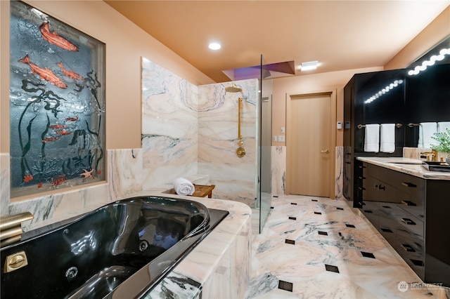 bathroom featuring tile patterned floors, vanity, and a tile shower