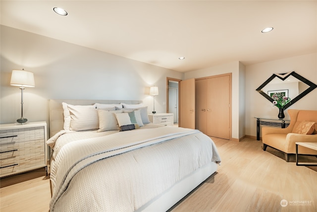 bedroom featuring light hardwood / wood-style flooring and a closet