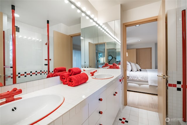 bathroom featuring hardwood / wood-style flooring and double sink vanity