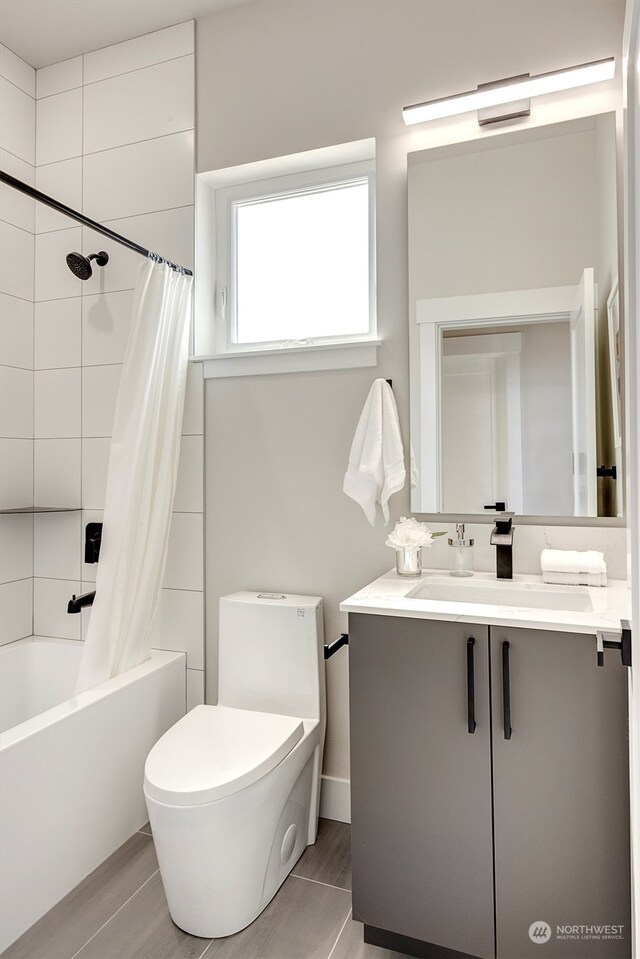 full bathroom featuring toilet, vanity, and shower / tub combo with curtain