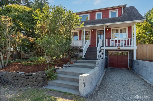 view of front facade featuring a garage and a porch