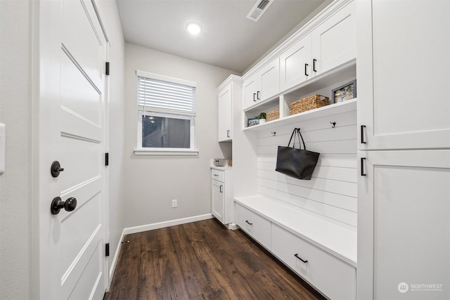 mudroom with visible vents, baseboards, and dark wood-style flooring