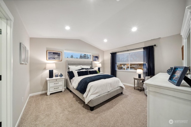 bedroom featuring vaulted ceiling and light carpet