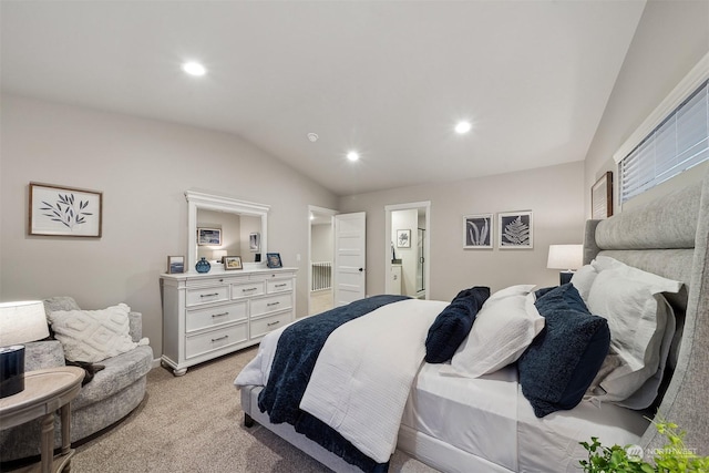 bedroom featuring lofted ceiling, connected bathroom, recessed lighting, and light carpet