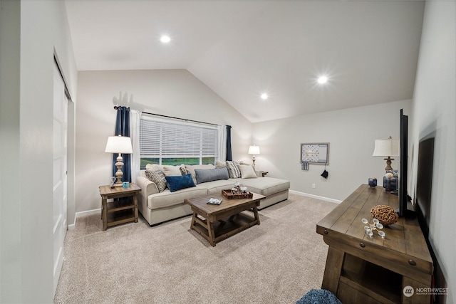 carpeted living room featuring lofted ceiling