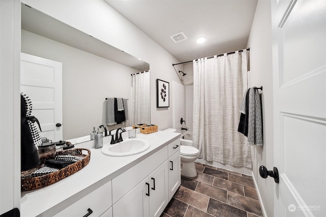 bathroom featuring shower / bath combo with shower curtain, visible vents, toilet, and vanity