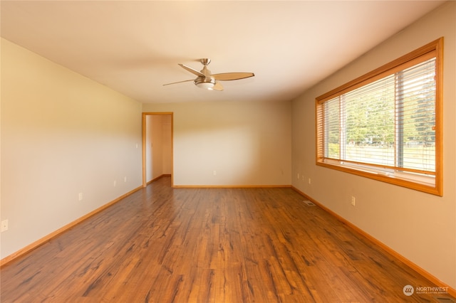 unfurnished room featuring ceiling fan and hardwood / wood-style floors