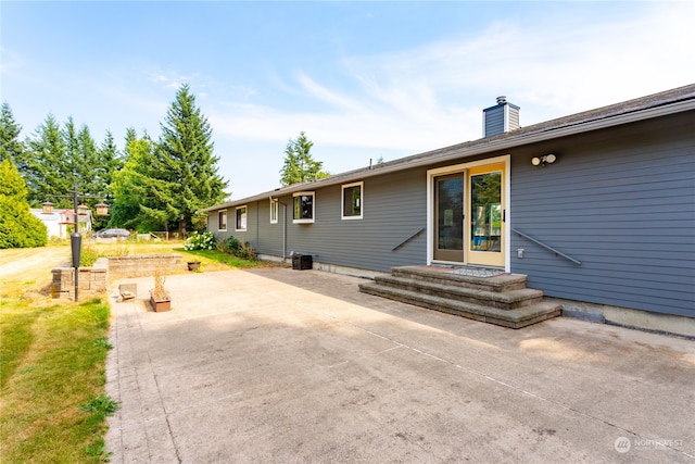 rear view of property with a patio area