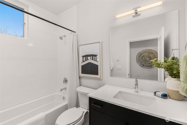 full bathroom with vanity, toilet, and shower / bath combo with shower curtain