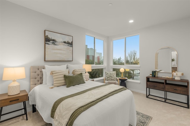 8045G Mary Ave NW, Seattle, WA 98117 - bedroom with multiple windows, light carpet, arched walkways, recessed lighting, and baseboards