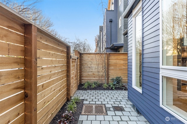 view of side of home with a patio