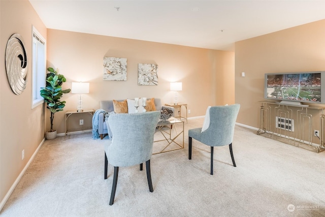 living room featuring baseboards and carpet floors