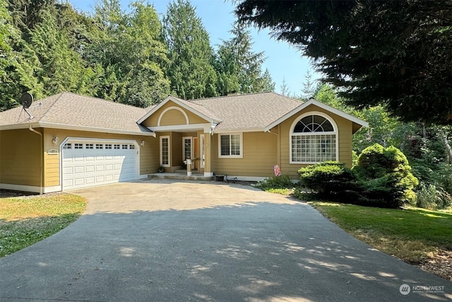 single story home featuring a garage