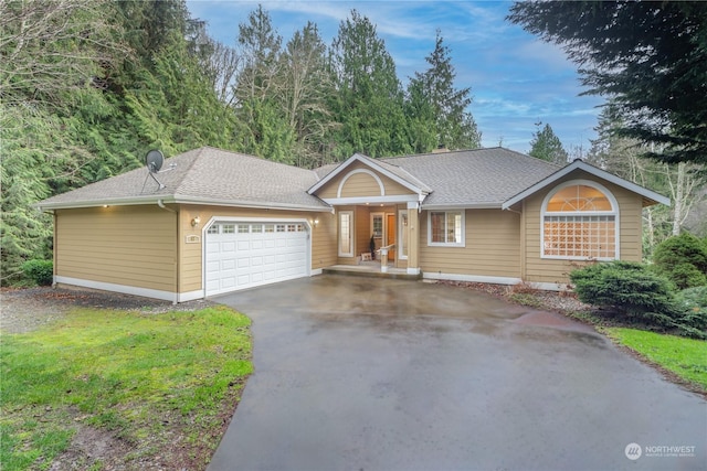 ranch-style house featuring a garage