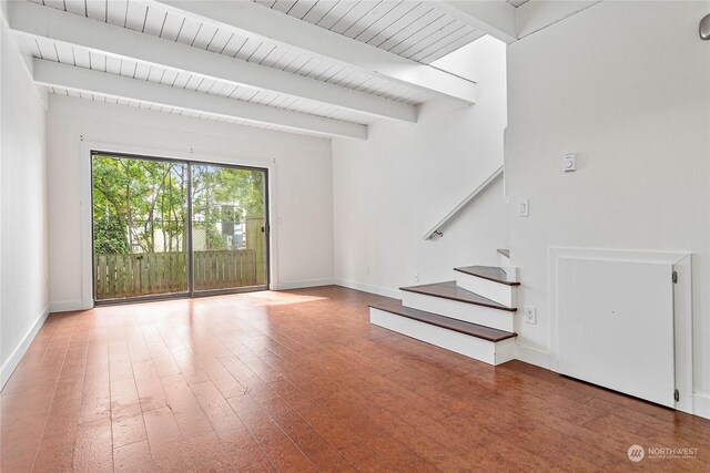 interior space featuring hardwood / wood-style flooring and beamed ceiling