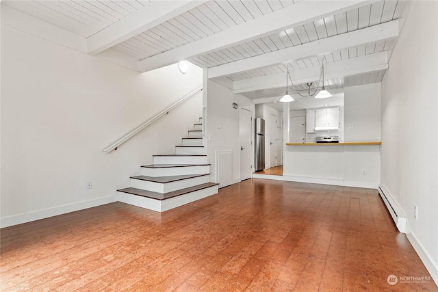 unfurnished living room with beam ceiling, a baseboard radiator, and wood-type flooring