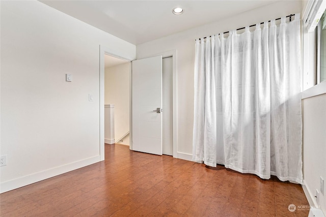 spare room with hardwood / wood-style flooring