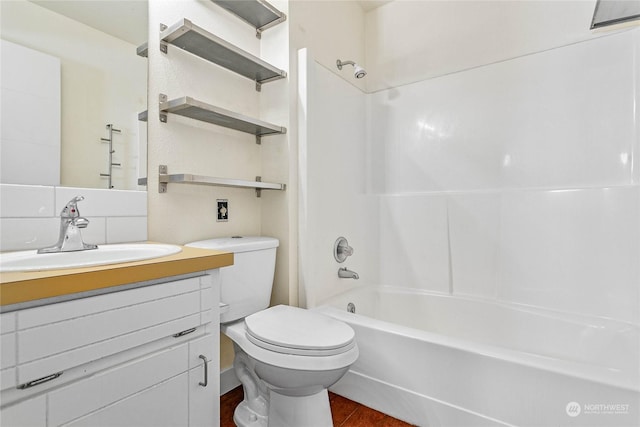 full bathroom with vanity, tub / shower combination, and toilet