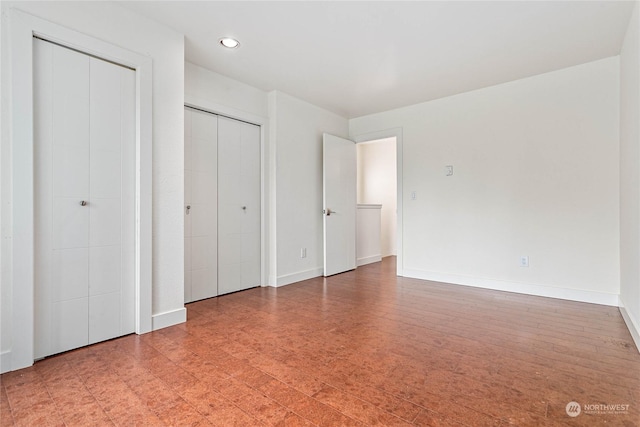 unfurnished bedroom featuring wood-type flooring