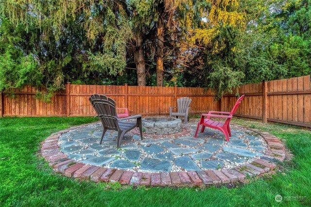 view of patio / terrace featuring a fire pit