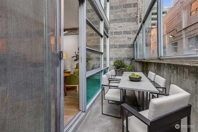 sunroom / solarium featuring a healthy amount of sunlight