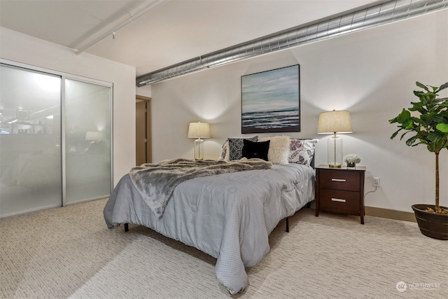 bedroom featuring light carpet