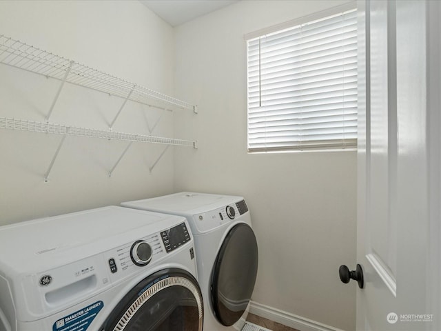 laundry area featuring washer and dryer and laundry area