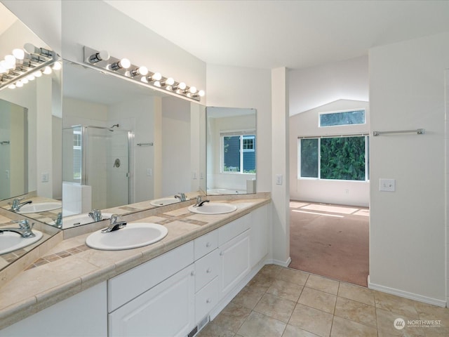 full bath featuring tile patterned flooring, a sink, a shower stall, and double vanity