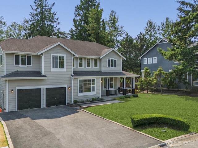 view of front of home featuring aphalt driveway, covered porch, an attached garage, and a front lawn