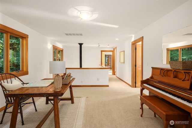 dining space featuring light colored carpet