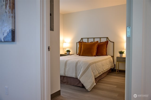 bedroom with light hardwood / wood-style floors