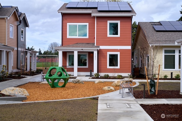 view of front of home featuring solar panels