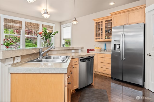 kitchen with pendant lighting, light brown cabinets, stainless steel appliances, sink, and dark hardwood / wood-style floors