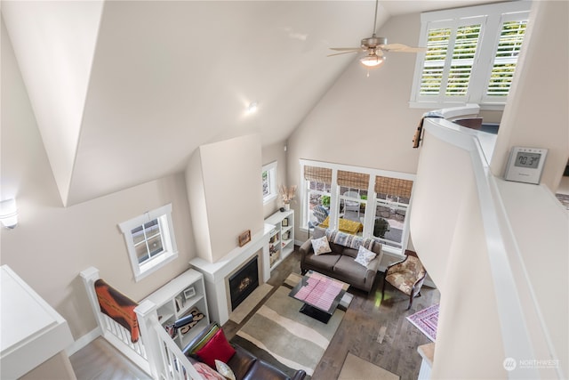 living room featuring high vaulted ceiling and ceiling fan