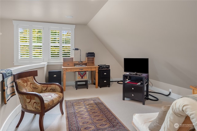 office featuring vaulted ceiling and light colored carpet