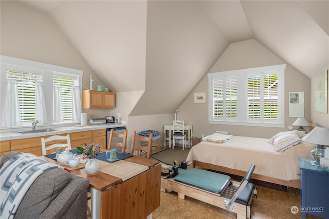 bedroom with lofted ceiling, light colored carpet, and multiple windows