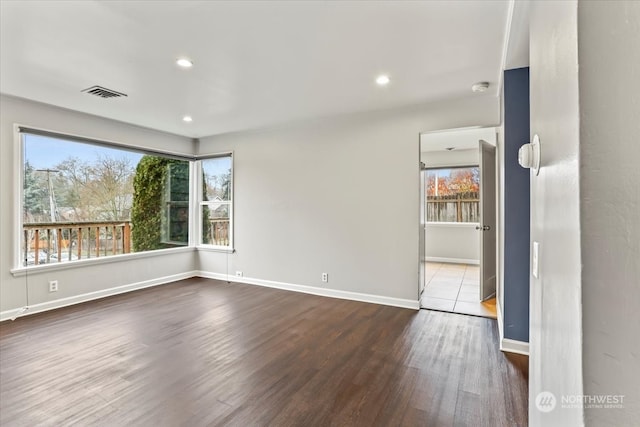 empty room with wood-type flooring