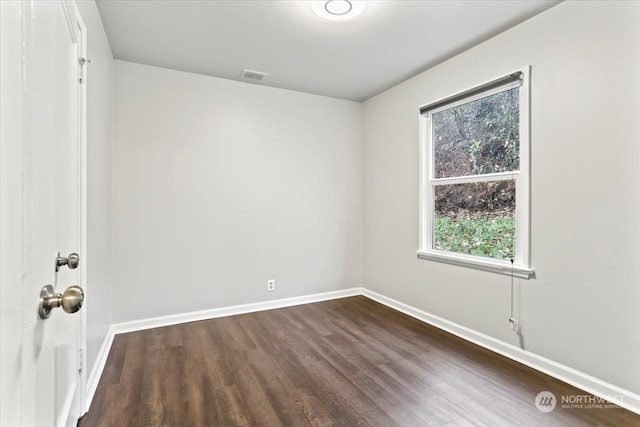 unfurnished room featuring wood-type flooring