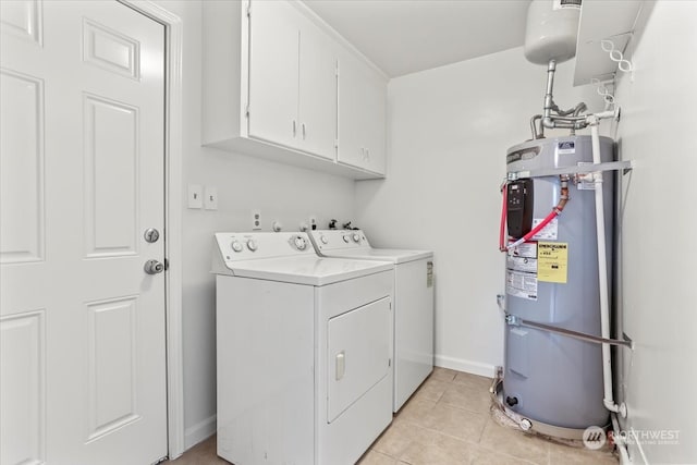 laundry room featuring light tile patterned floors, cabinets, heat pump water heater, and washer and dryer