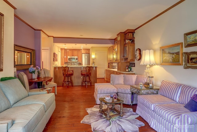 living room featuring ornamental molding and wood-type flooring