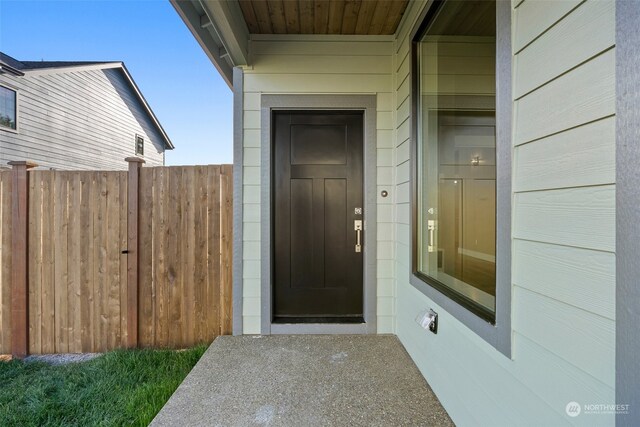 doorway to property with fence