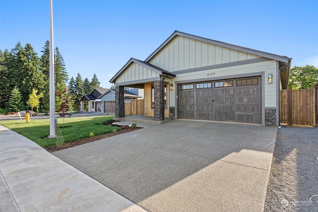 view of front facade featuring a front yard and a garage