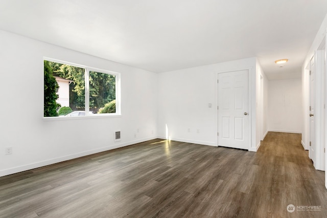 unfurnished room featuring wood-type flooring