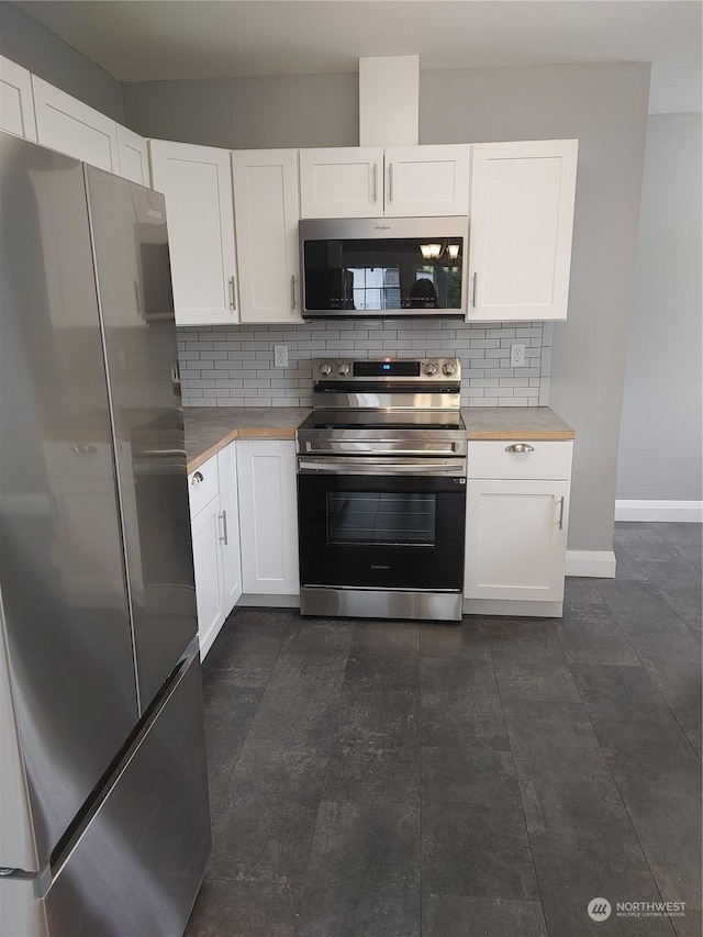 kitchen featuring white cabinetry, tasteful backsplash, and appliances with stainless steel finishes