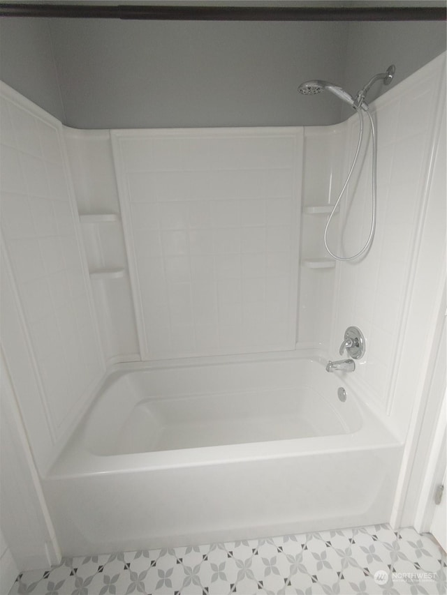 bathroom featuring washtub / shower combination and tile patterned floors